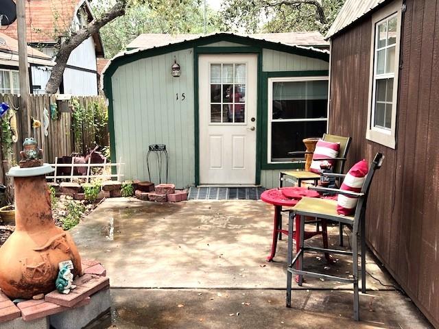 a backyard of a house with table and chairs