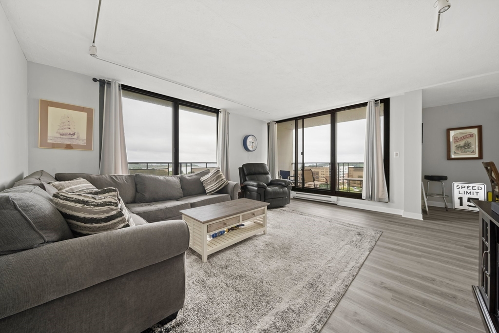 a living room with furniture and a large window