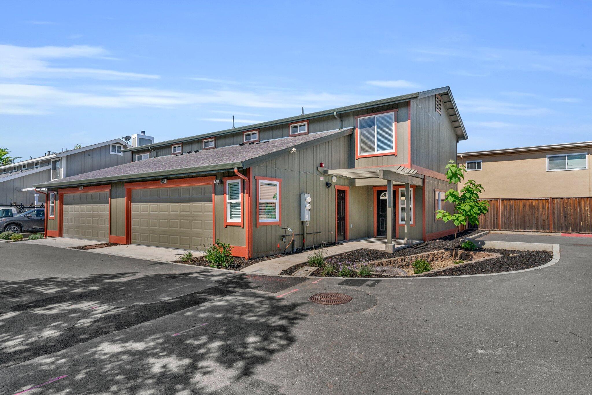 a front view of a house with a garage