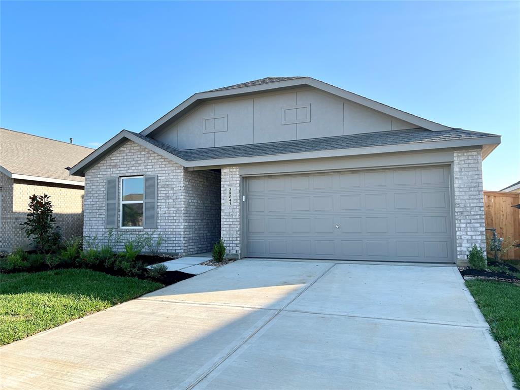 a front view of a house with yard