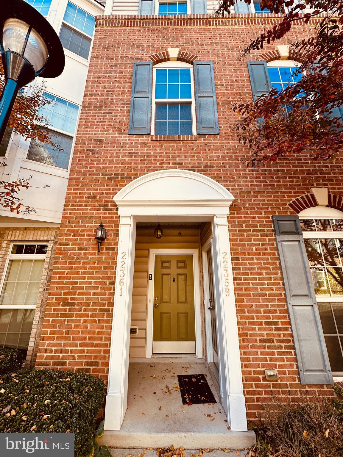 front view of a brick house with a door