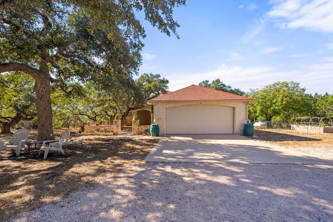 a view of a house with a yard and garage