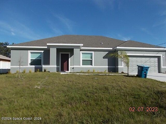 front view of house with a yard