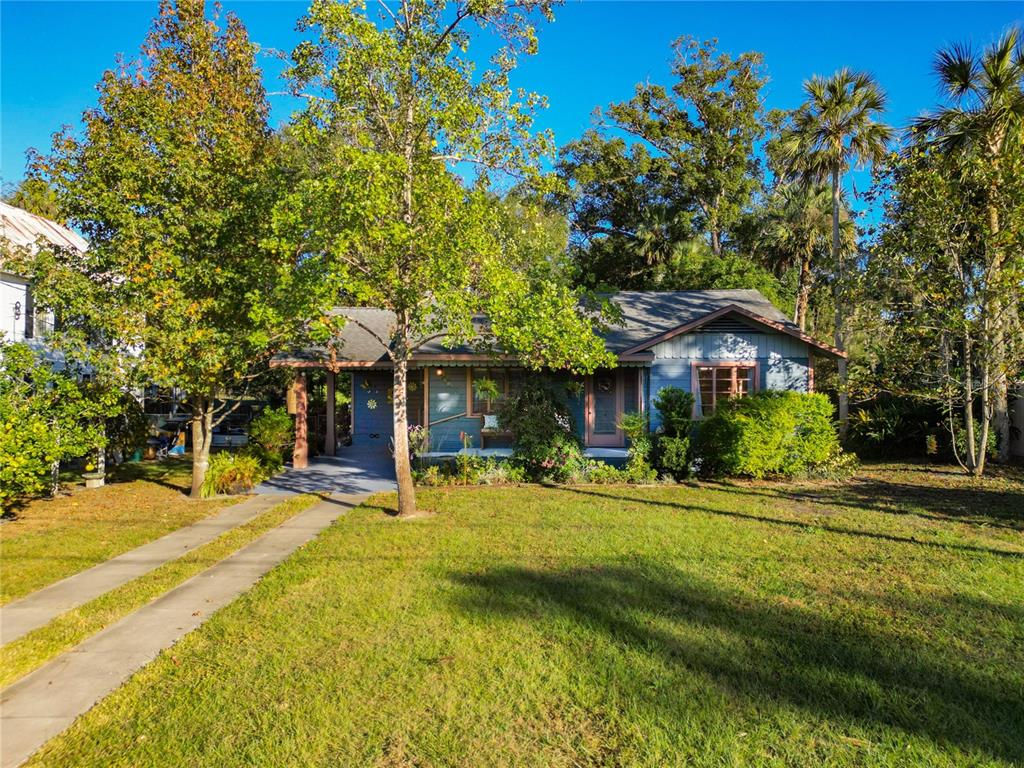 a view of a house with a yard