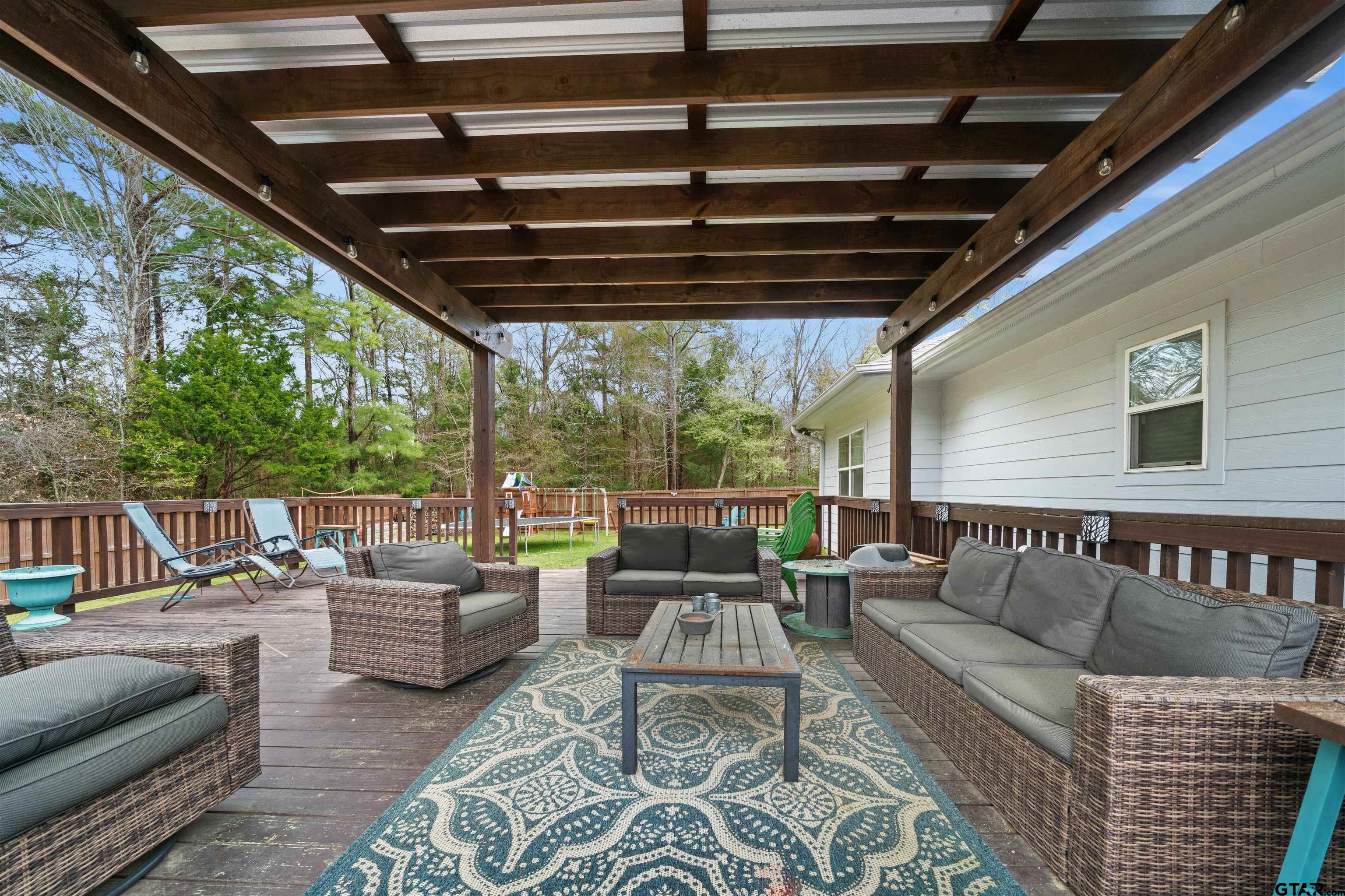 a outdoor living space with patio furniture and garden view