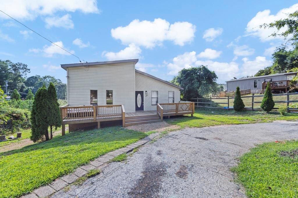 a view of a house with a back yard