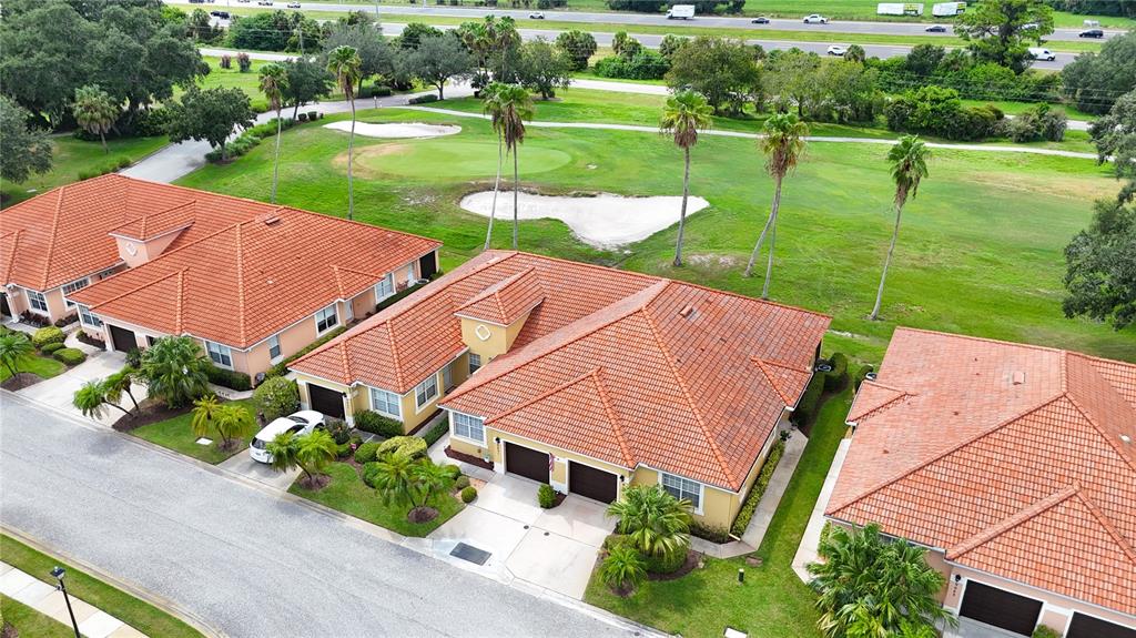 an aerial view of a house with big yard