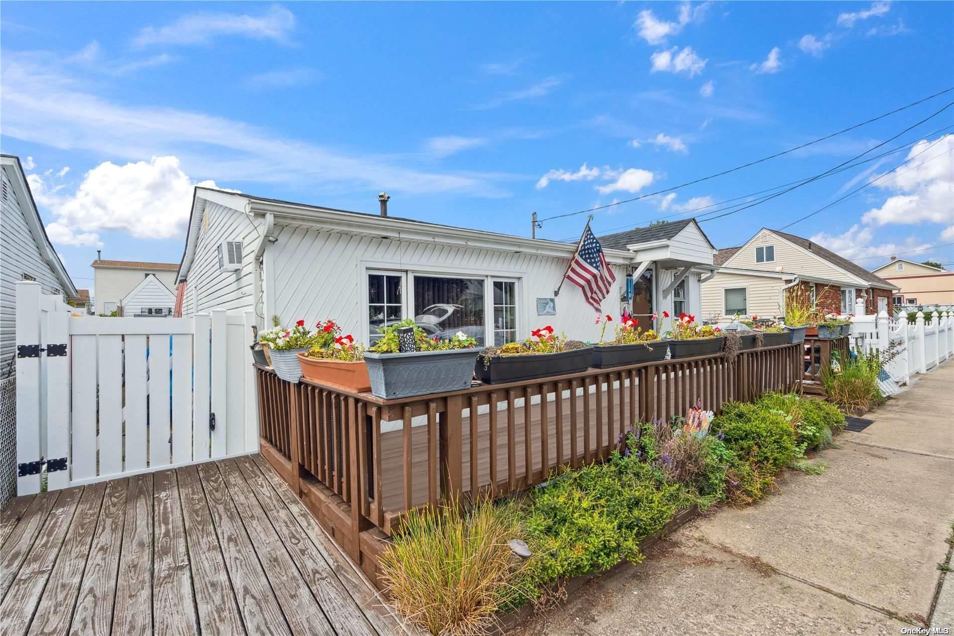 a view of a house with wooden fence