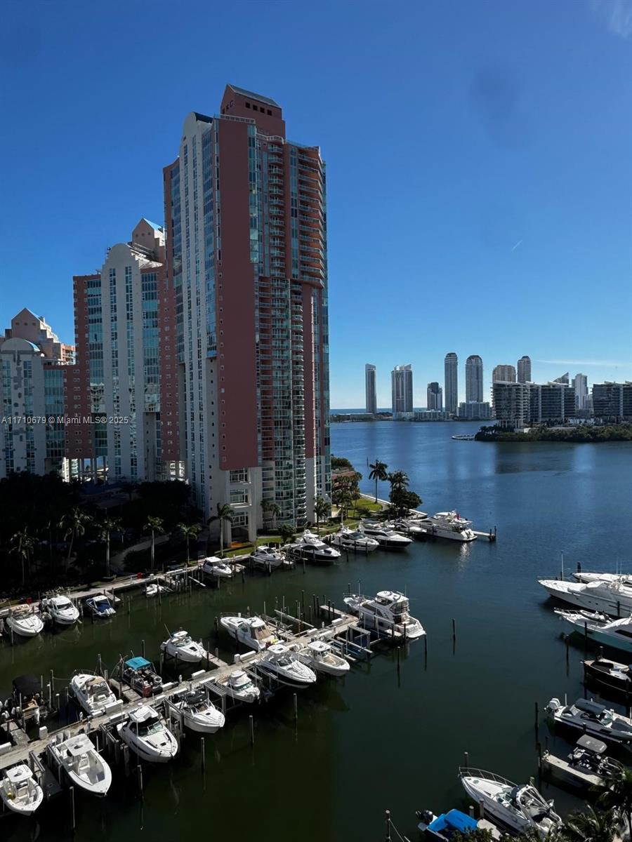 a view of a lake with tall buildings