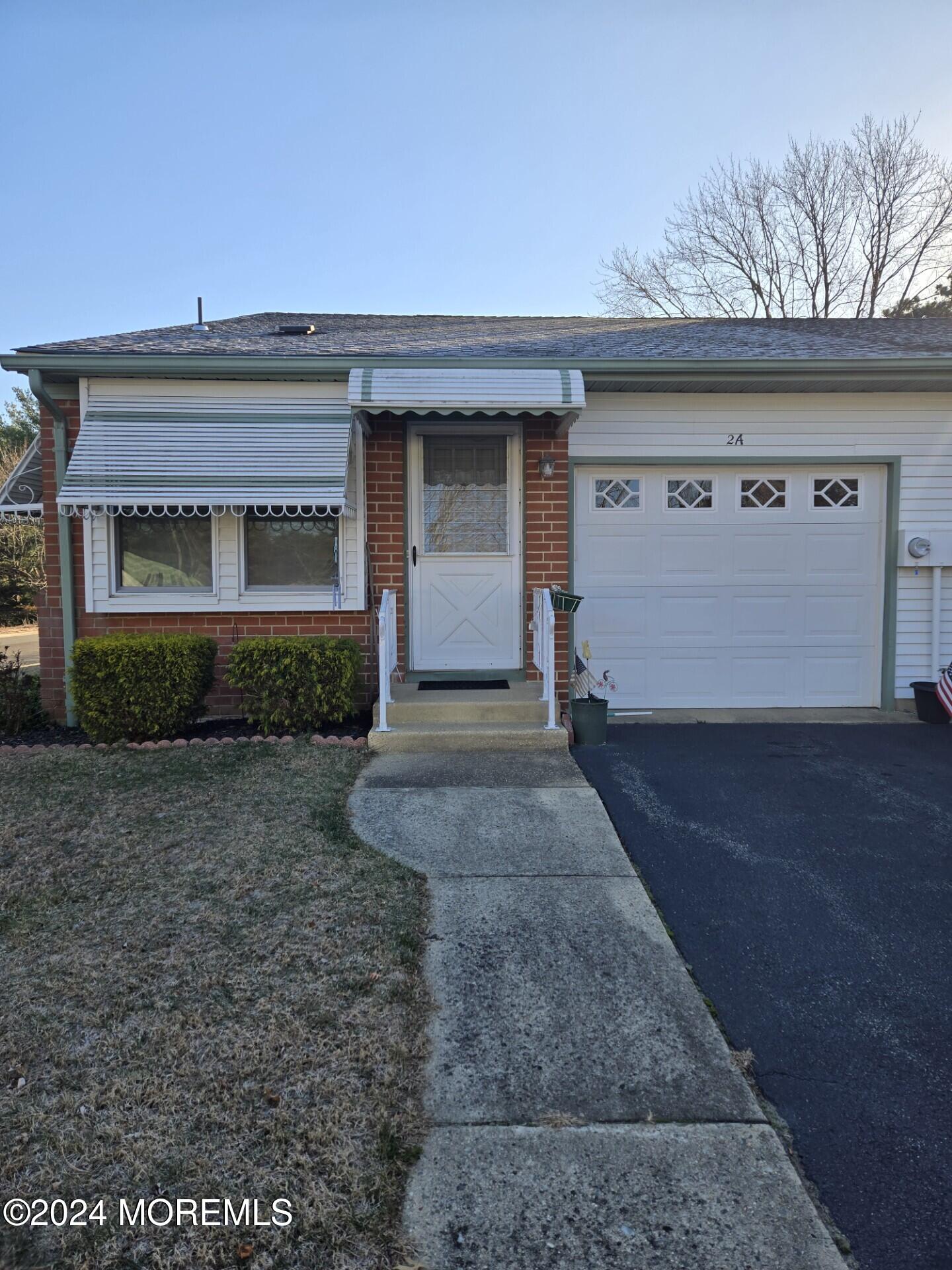 a front view of a house with yard