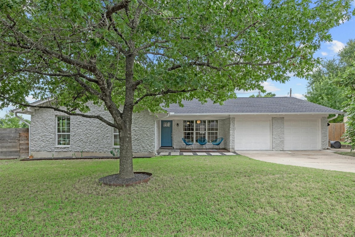 a front view of house with yard and green space