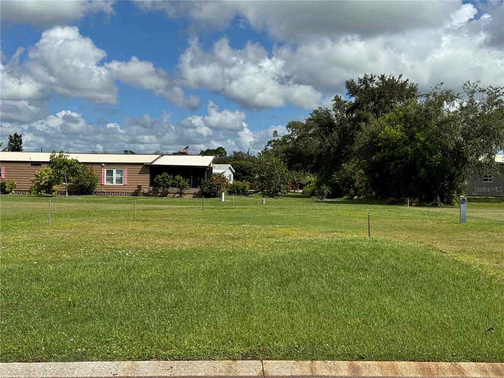 a view of a house with a big yard