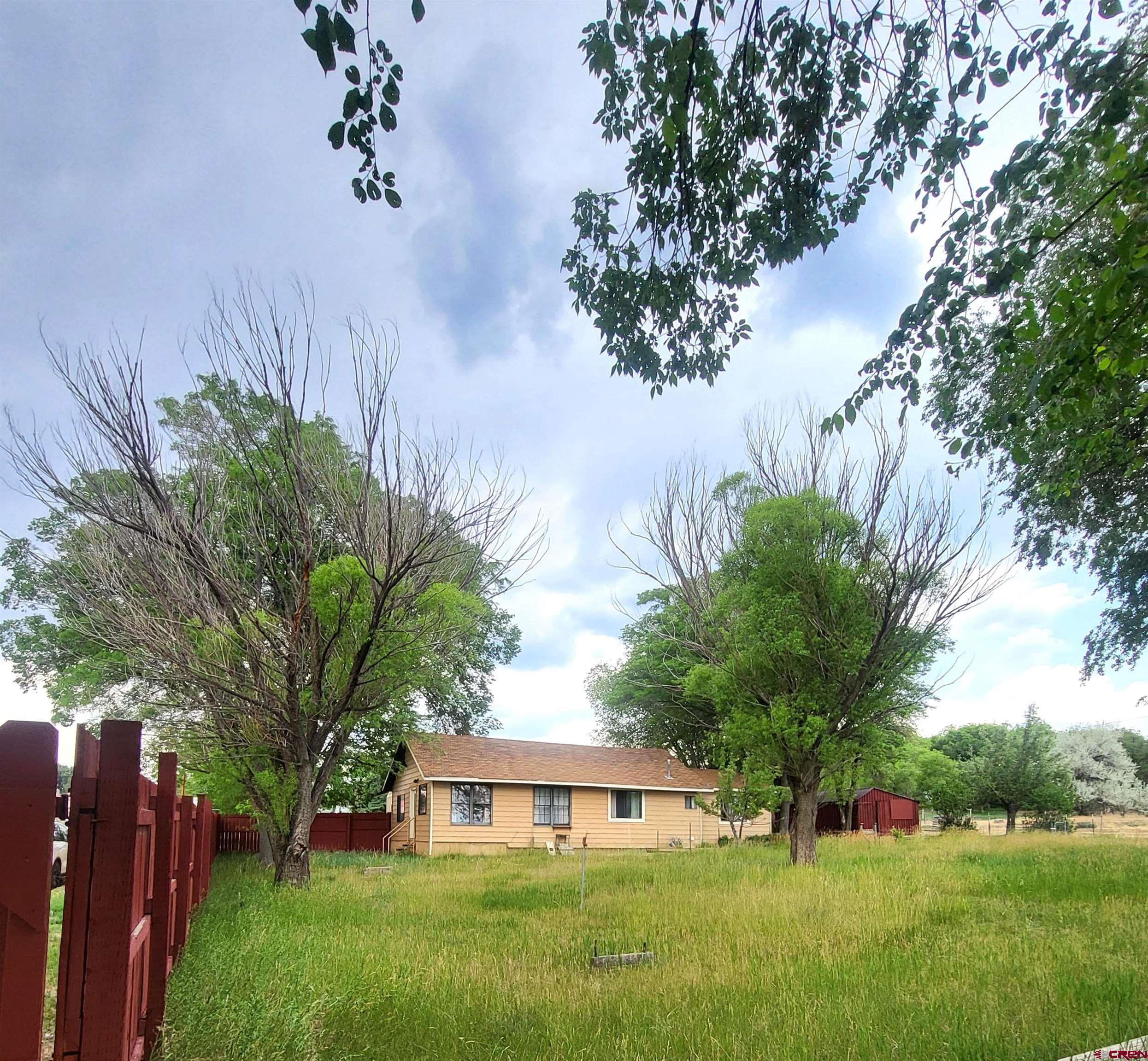 a view of a house with a yard