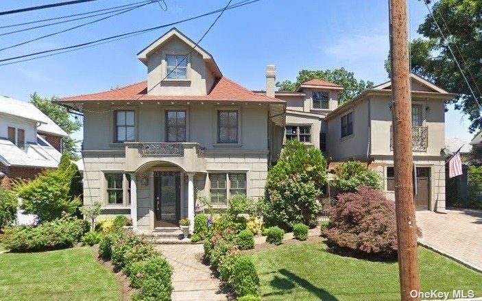 front view of a house with a small yard