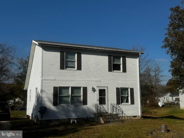 a front view of a house with yard