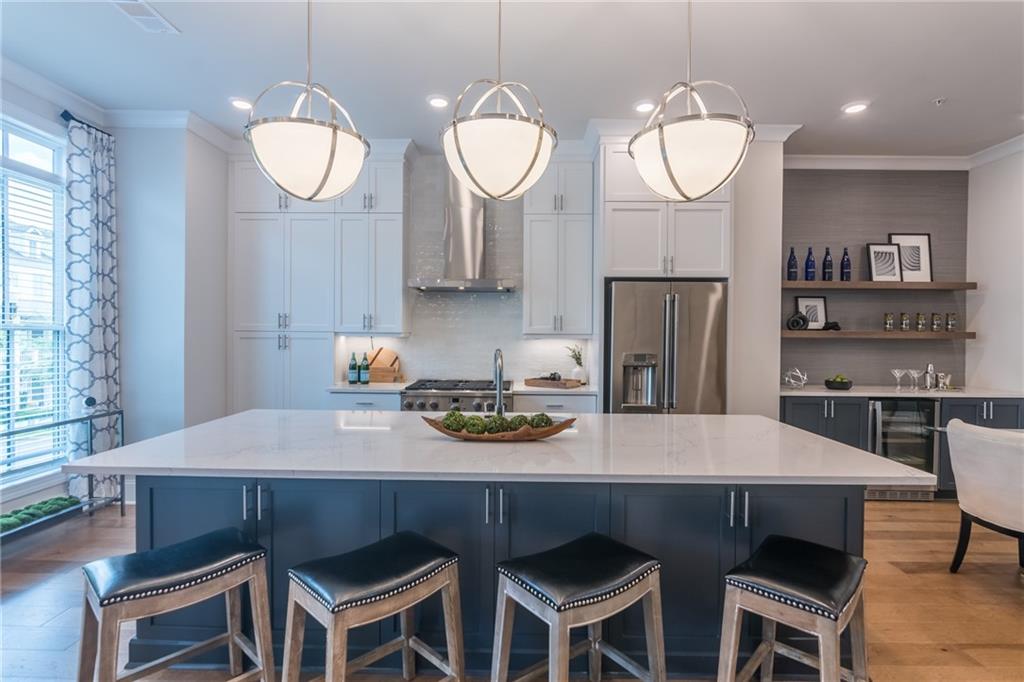 a kitchen with a dining table and chairs