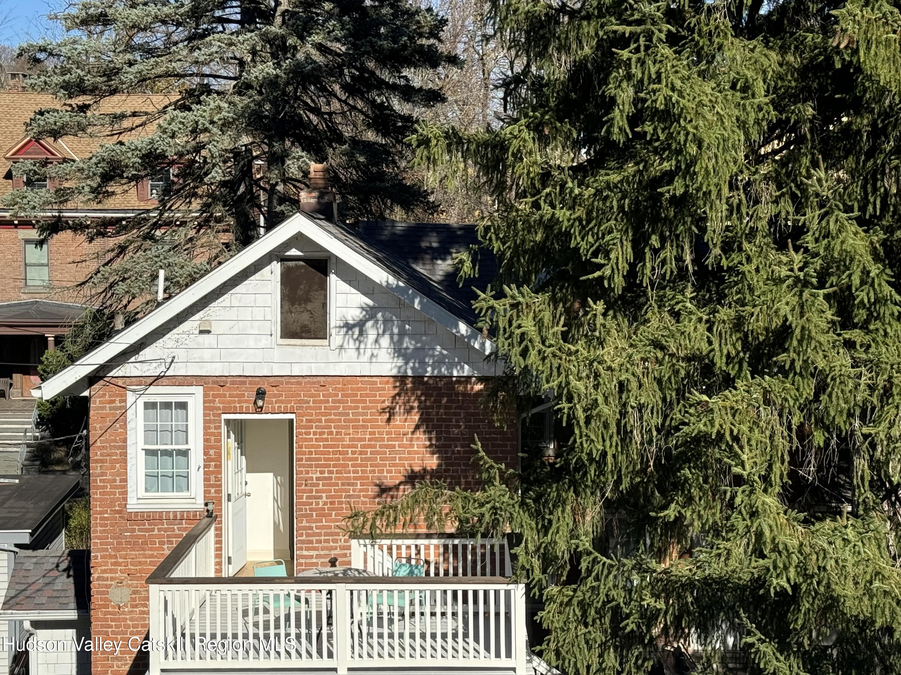 a view of a house with a small yard