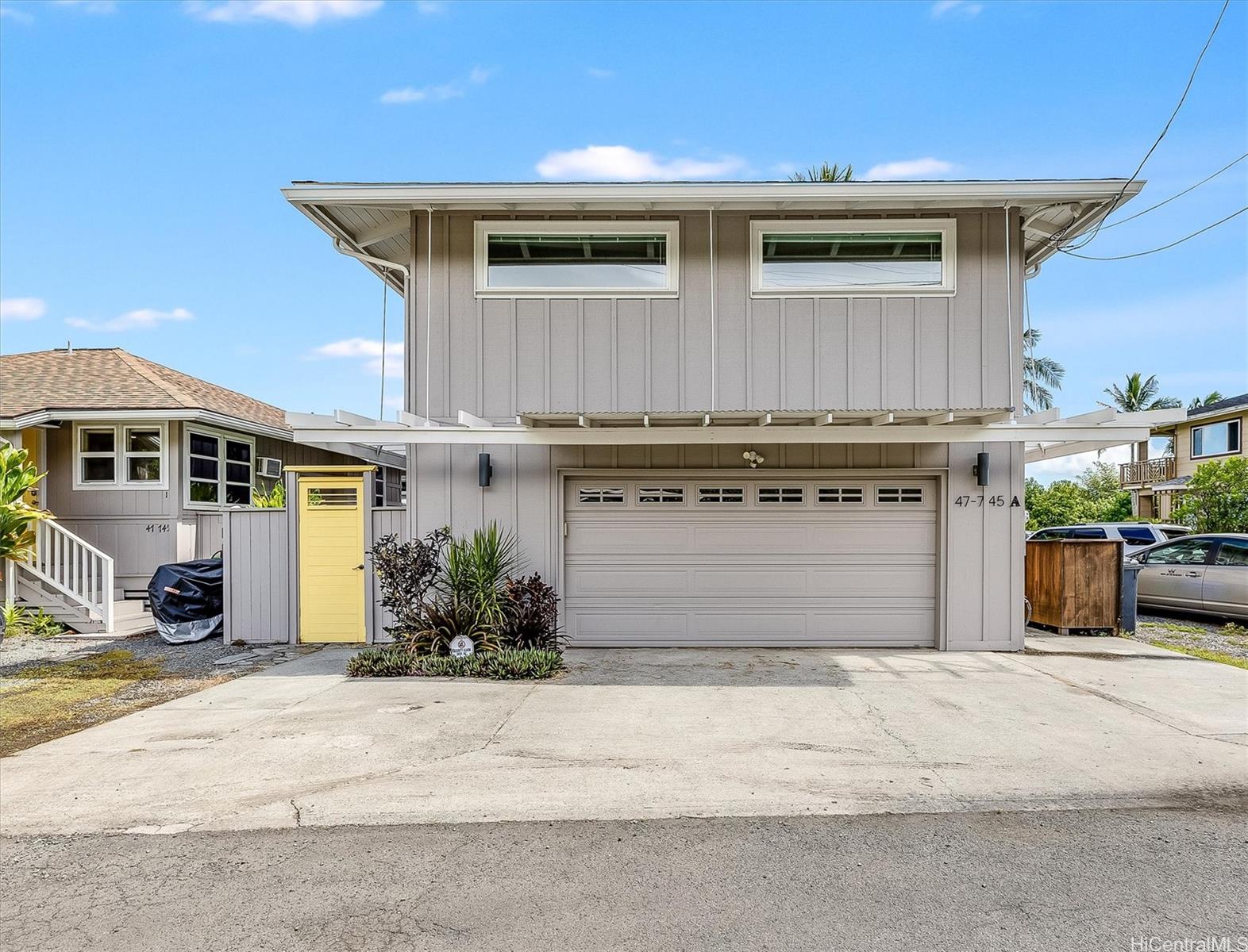 a front view of a house with yard