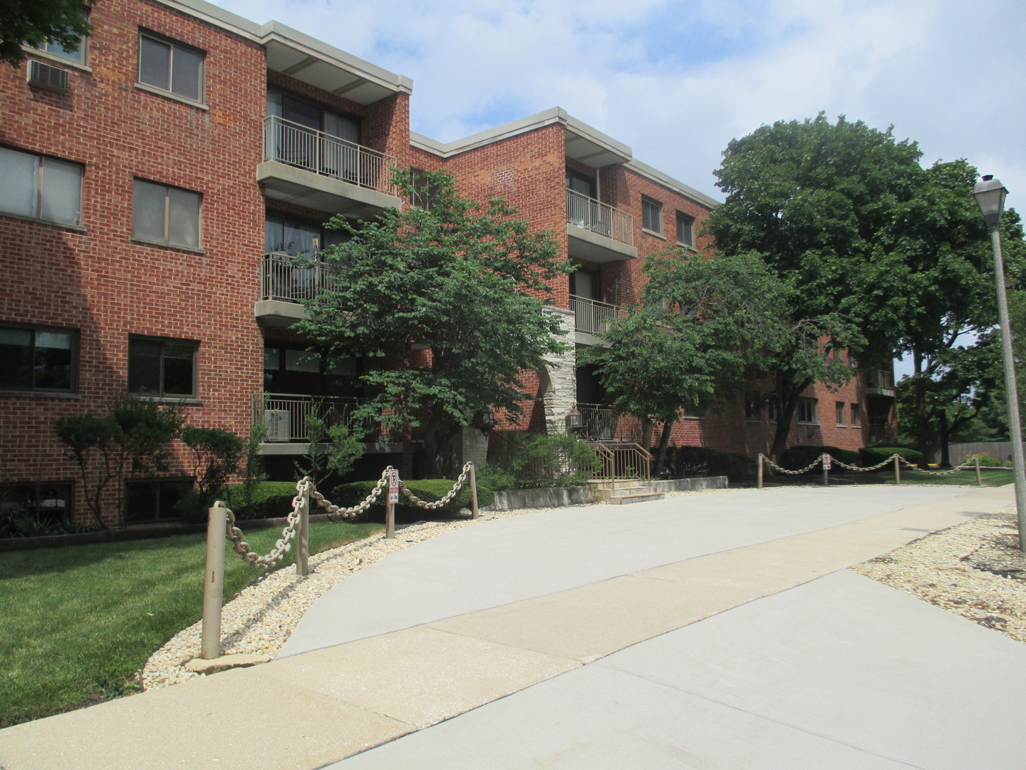 a view of a building with a yard