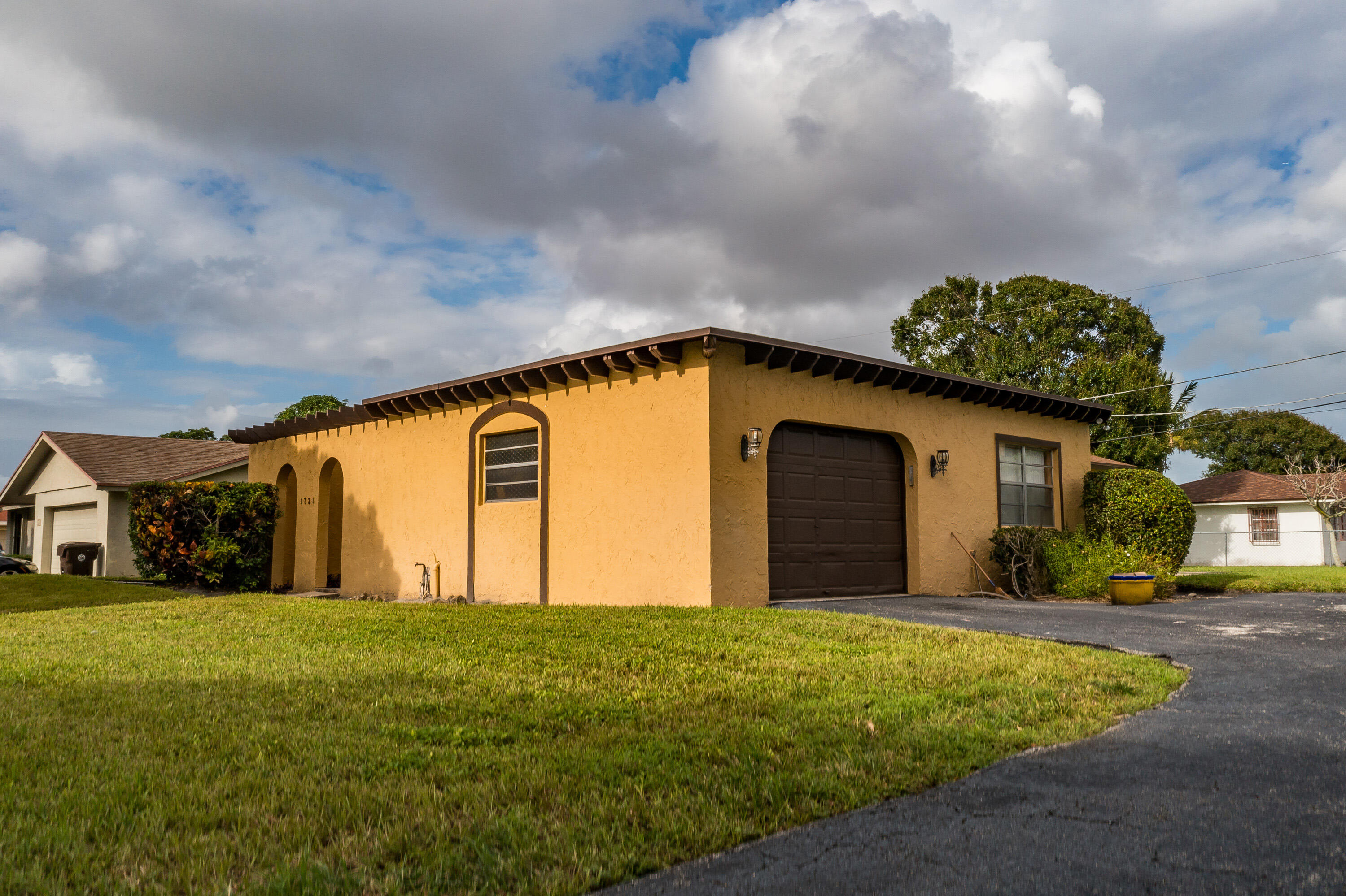 a front view of building with yard