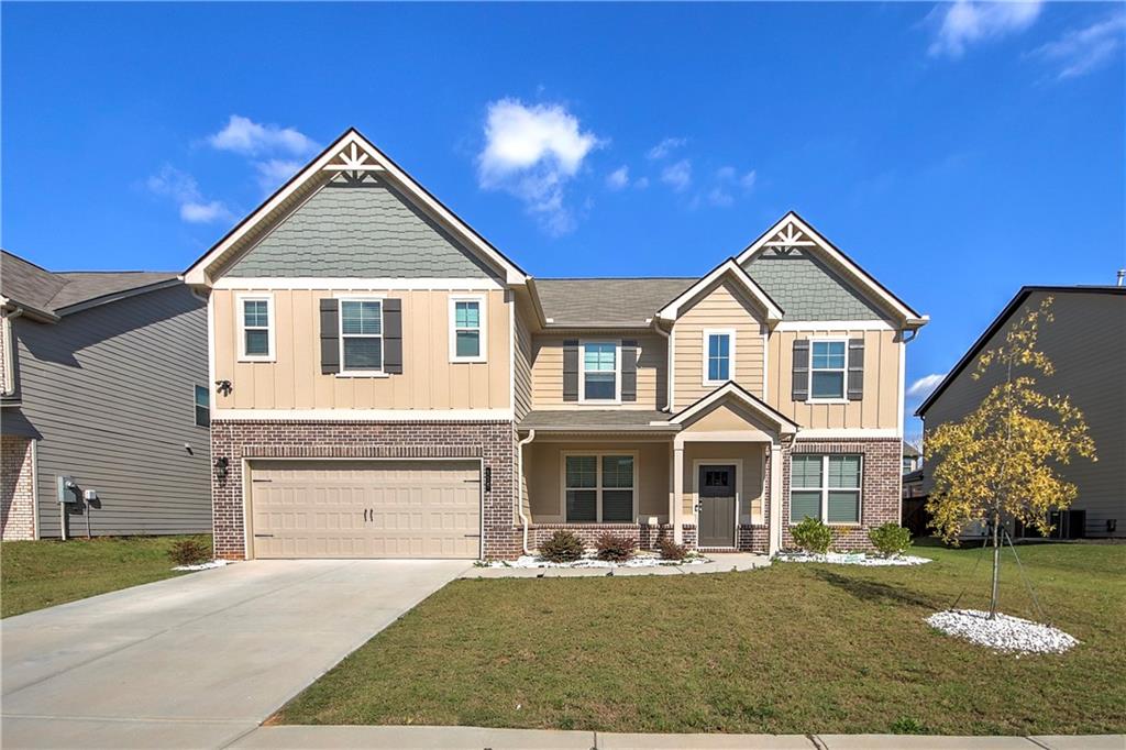 a front view of a house with a yard