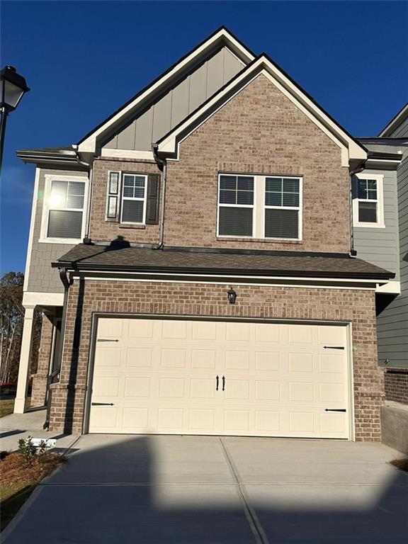 a front view of a house with a garage