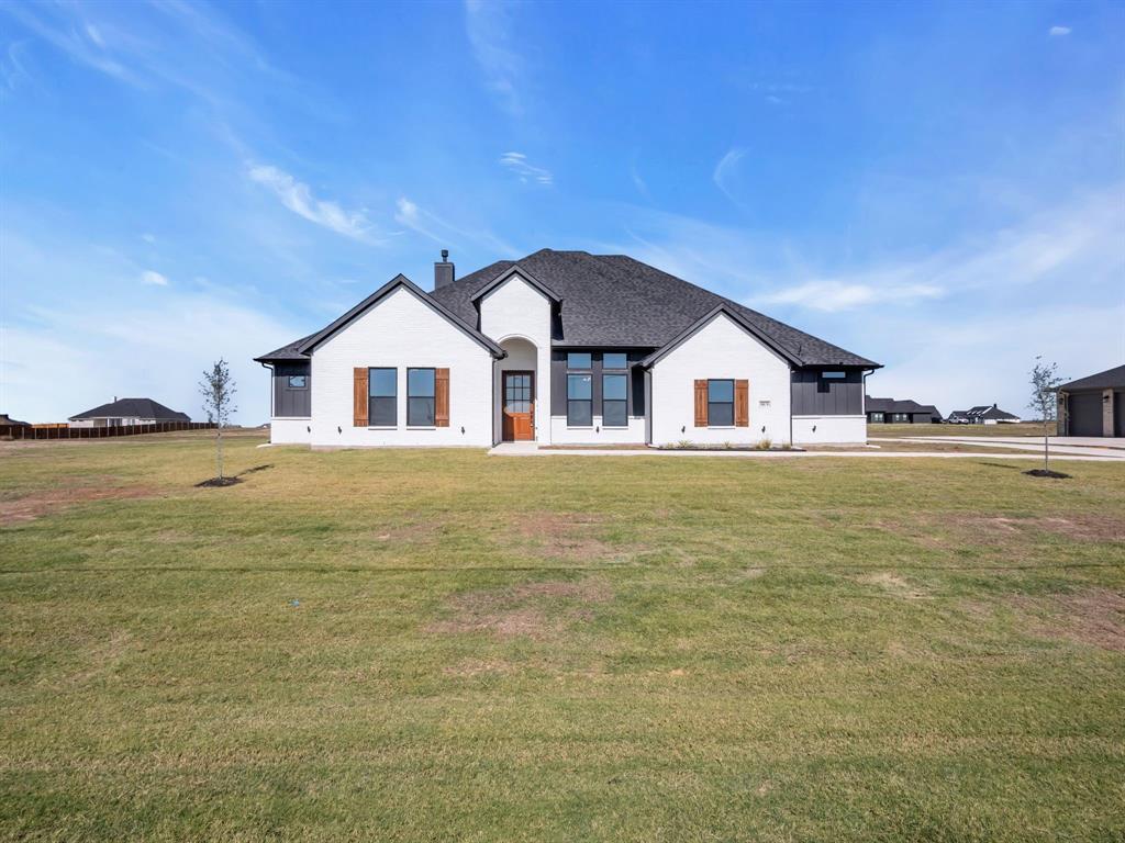 a big white house with a white roof