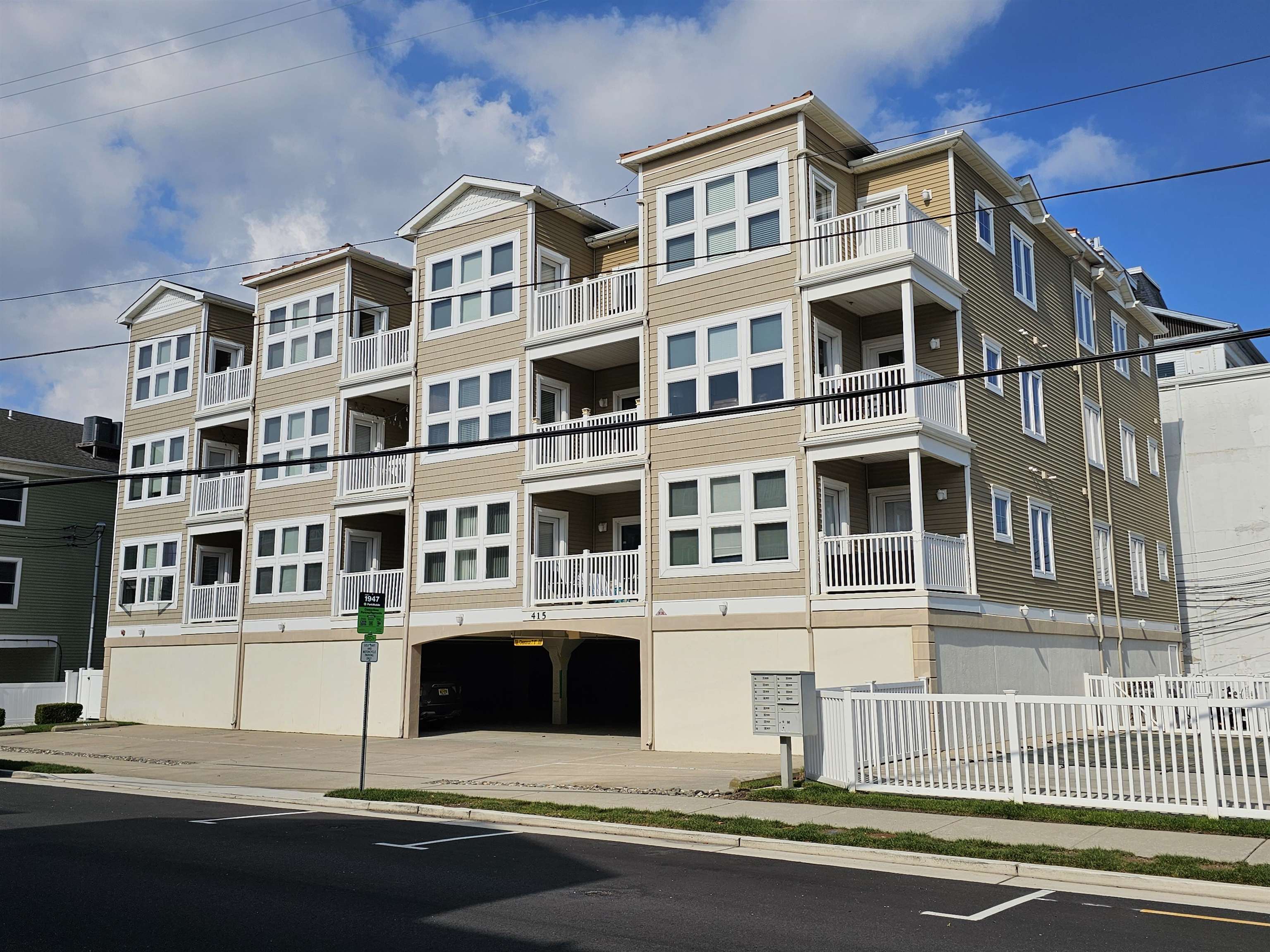 a front view of a building with a road