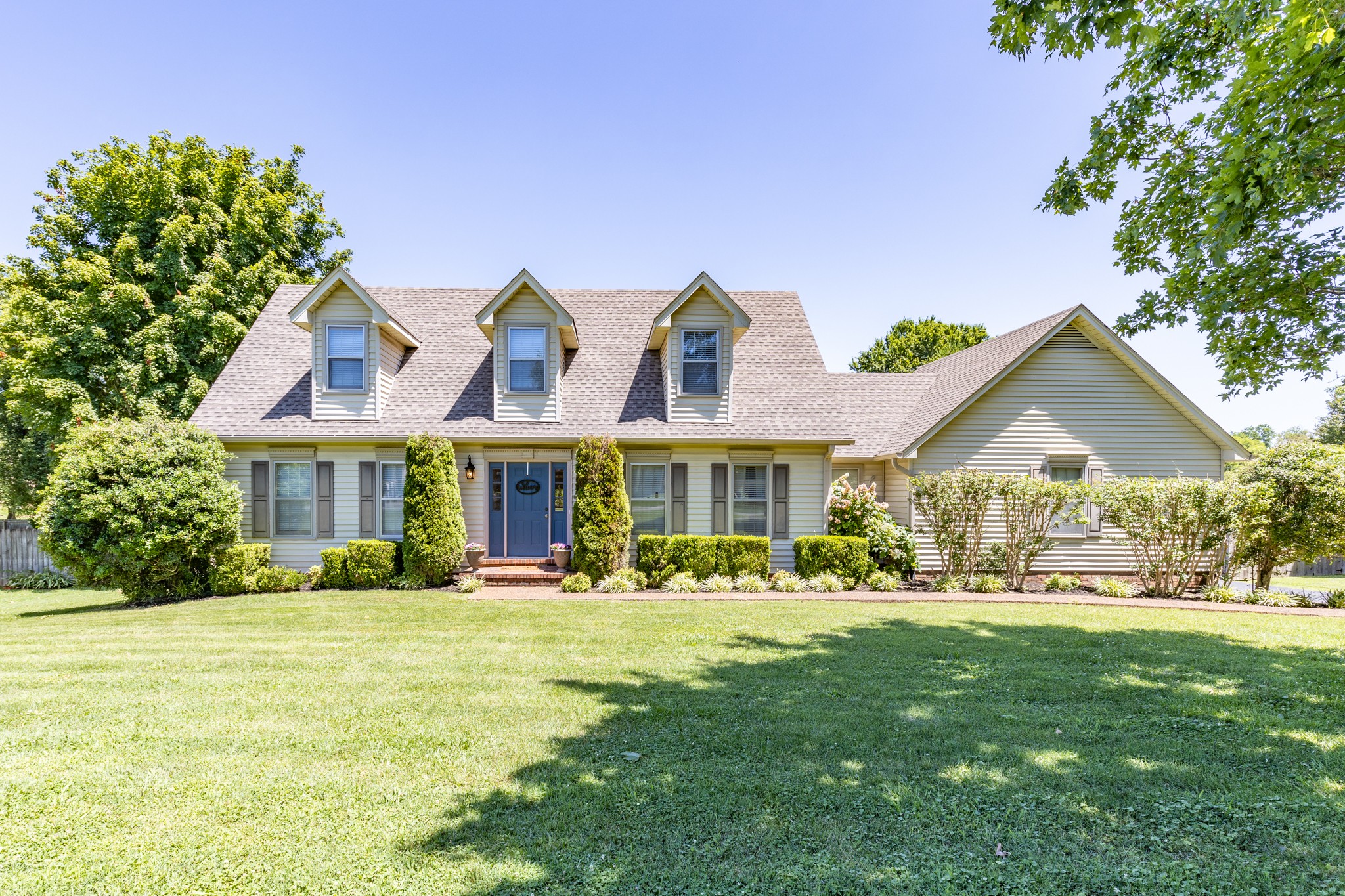 a front view of a house with a yard