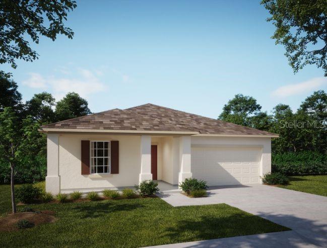 a front view of a house with a garden and yard