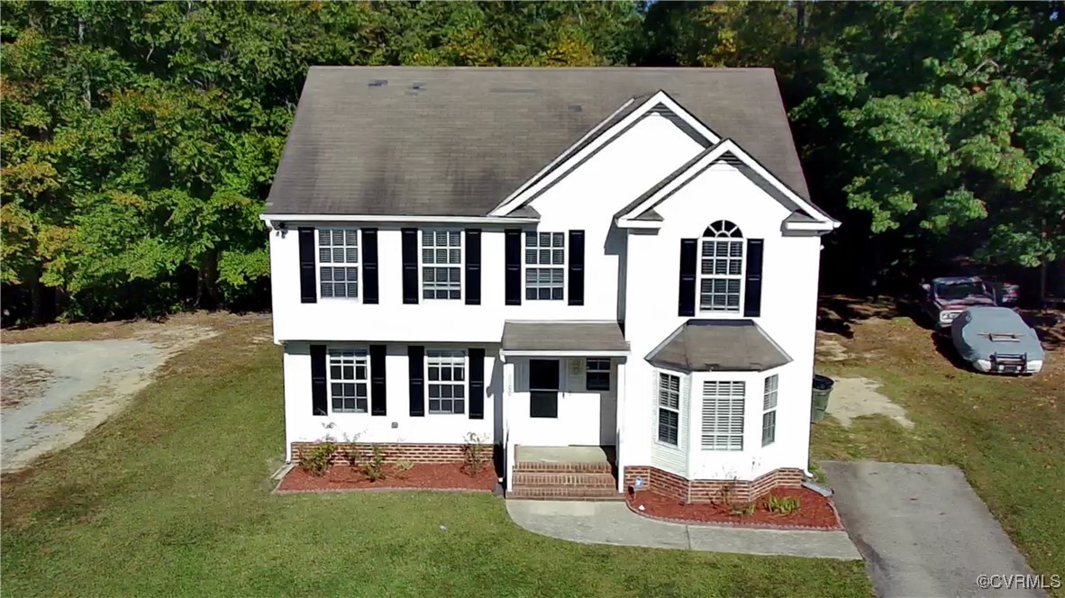 front view of house with a yard