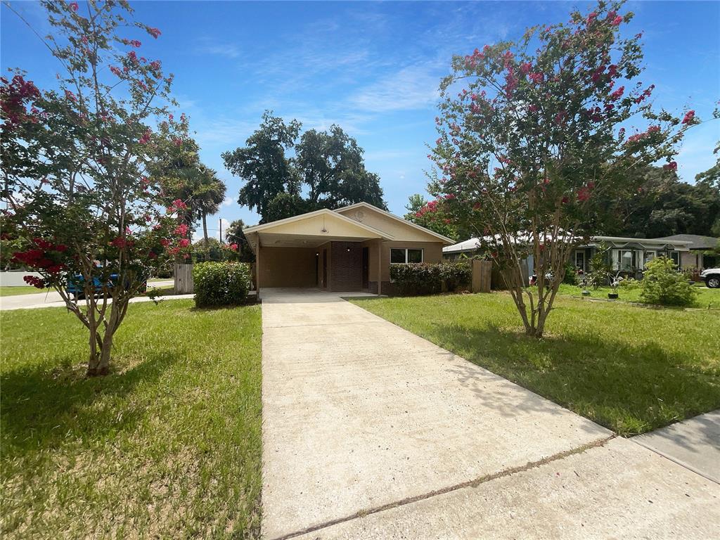 front view of a house with a yard