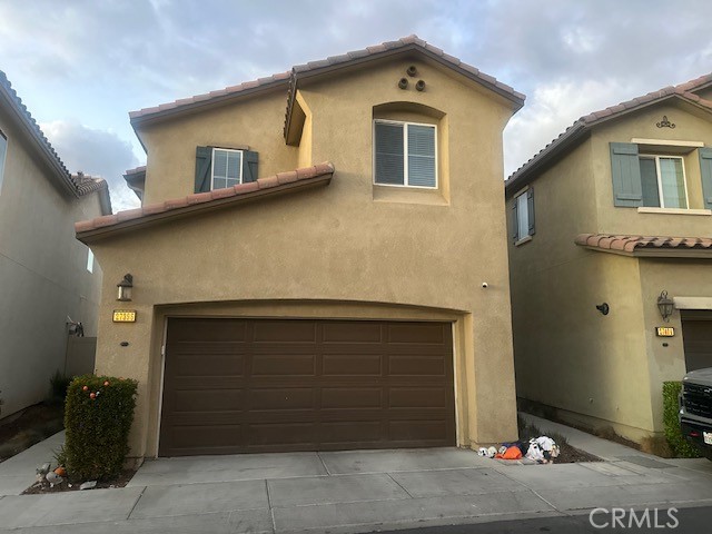 a front view of a house with parking