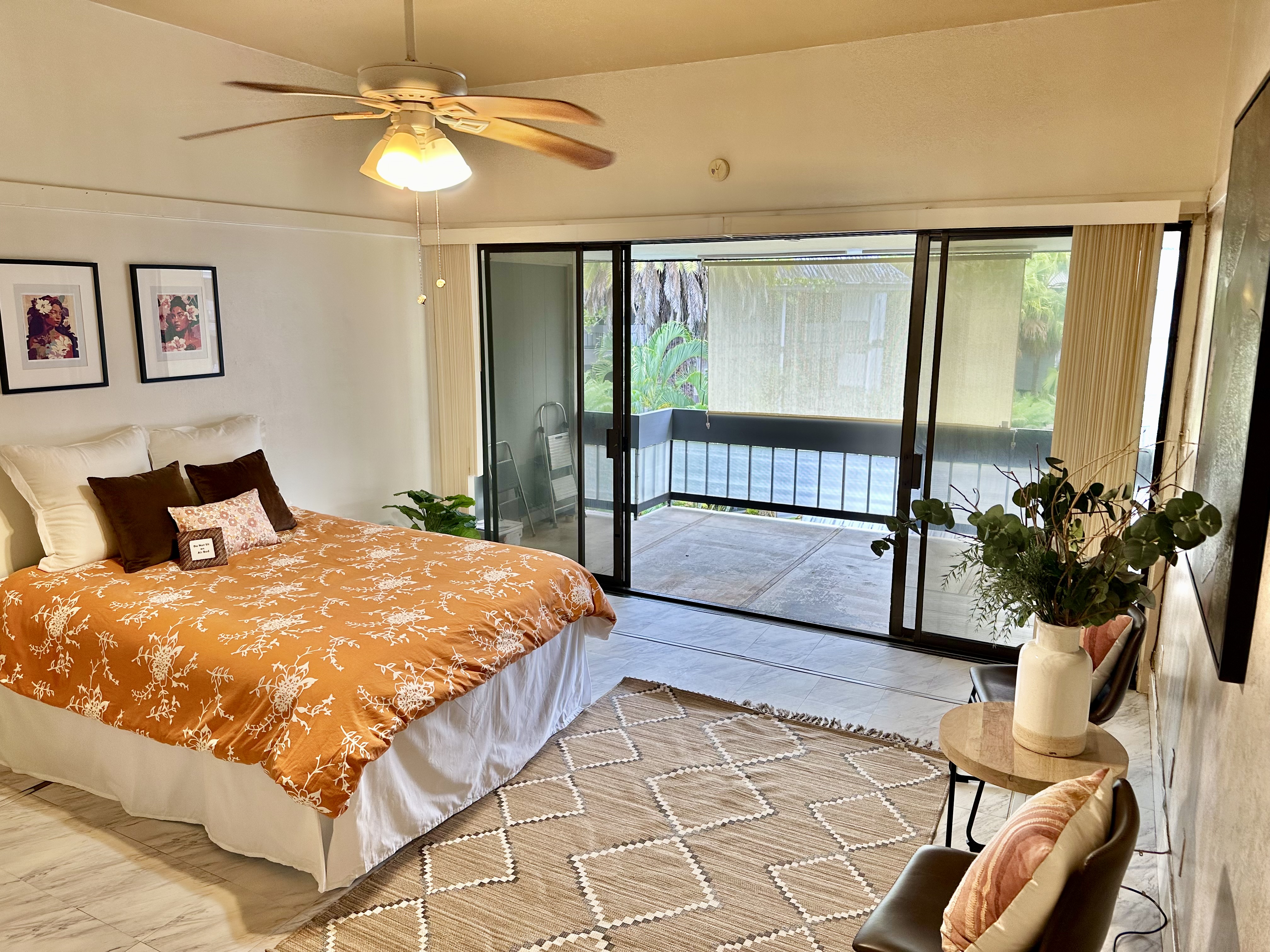 a bed sitting in a bedroom next to a window