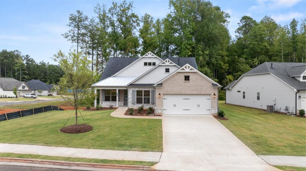 a front view of a house with garden