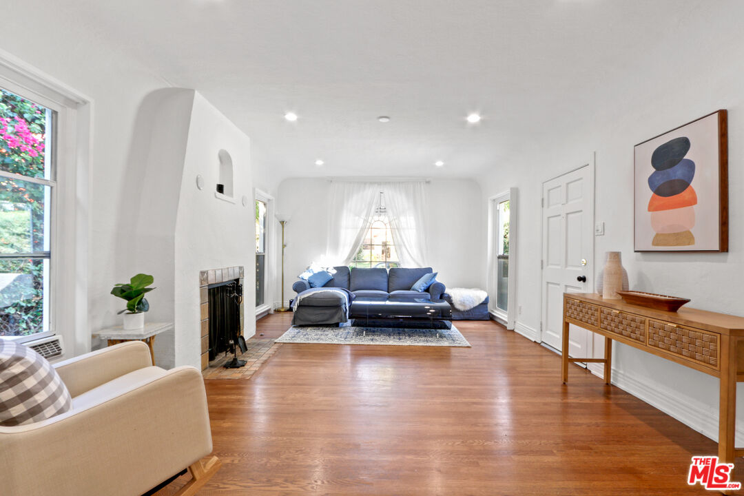 a living room with furniture or couch and a fireplace