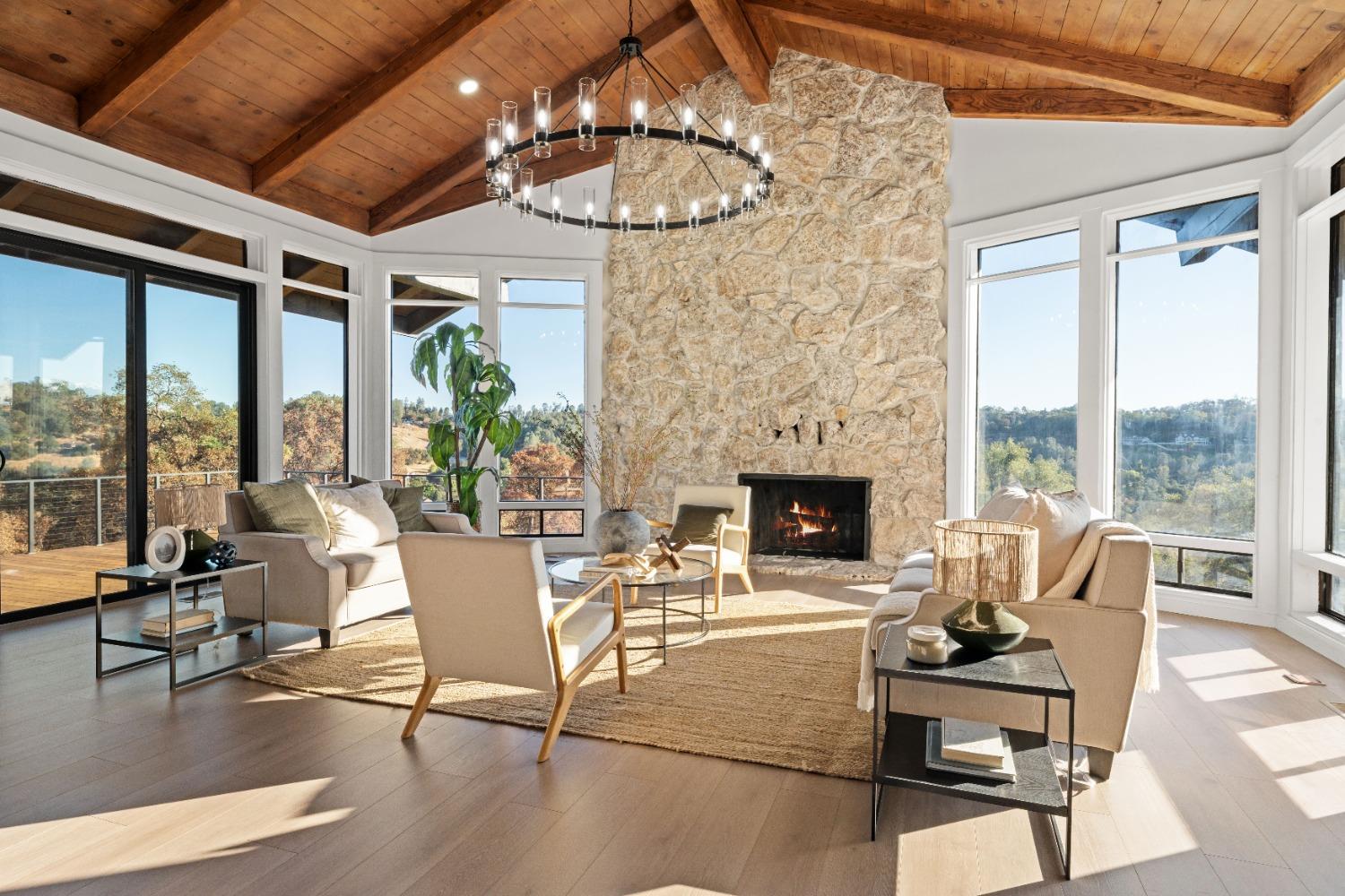 a view of a livingroom with furniture window and wooden floor