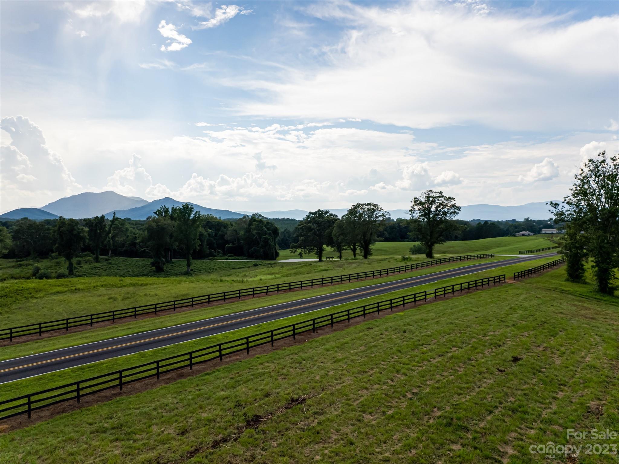 a view of a field with a big yard