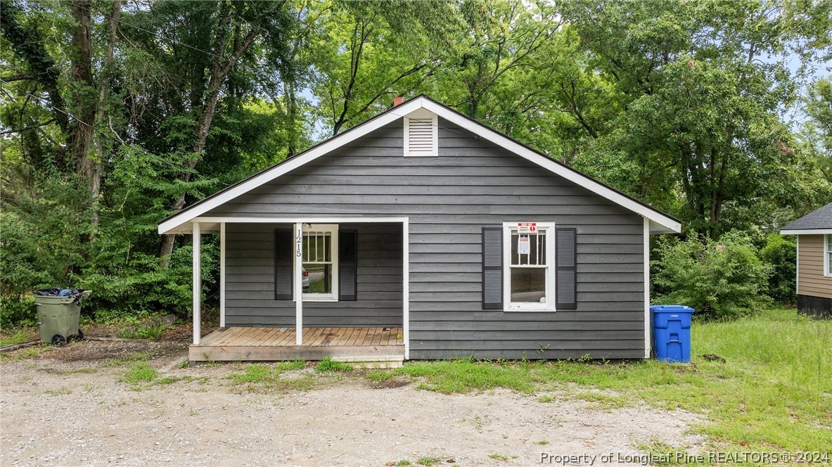 a view of a small house in front of a house