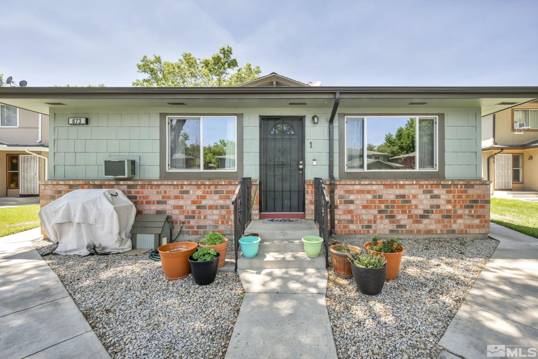 a view of a house with outdoor seating