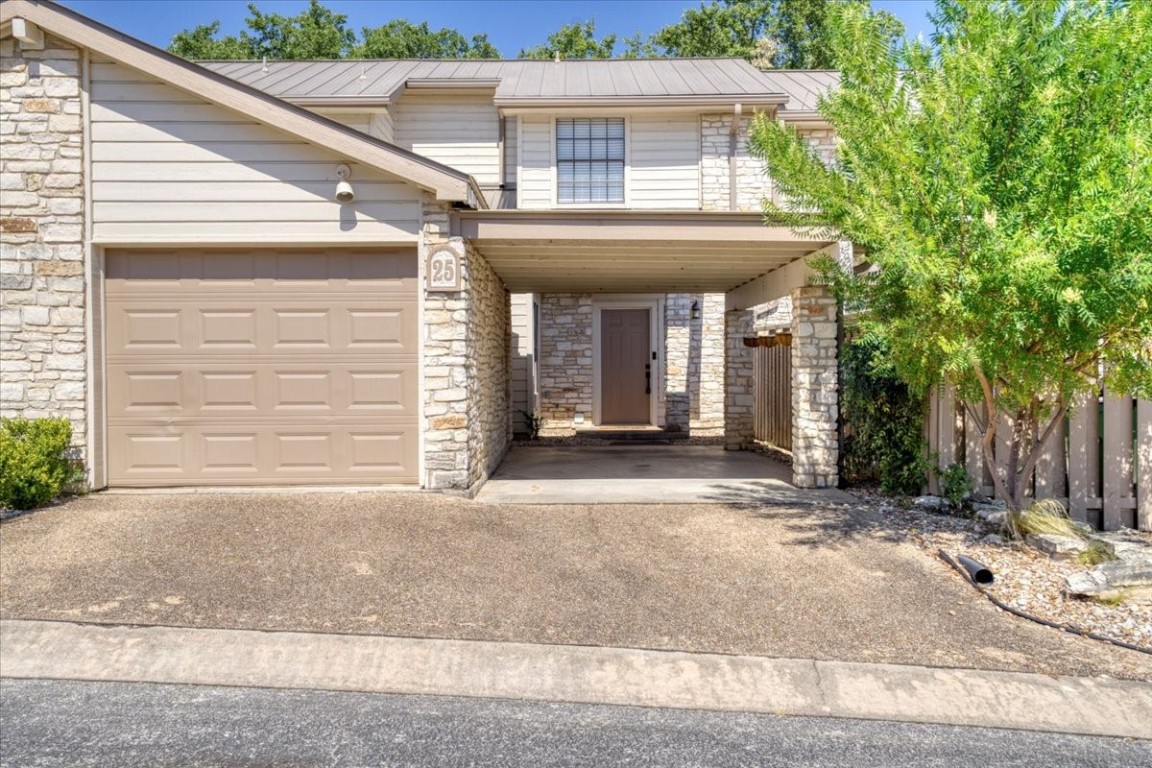 a view of a house with a patio and garage