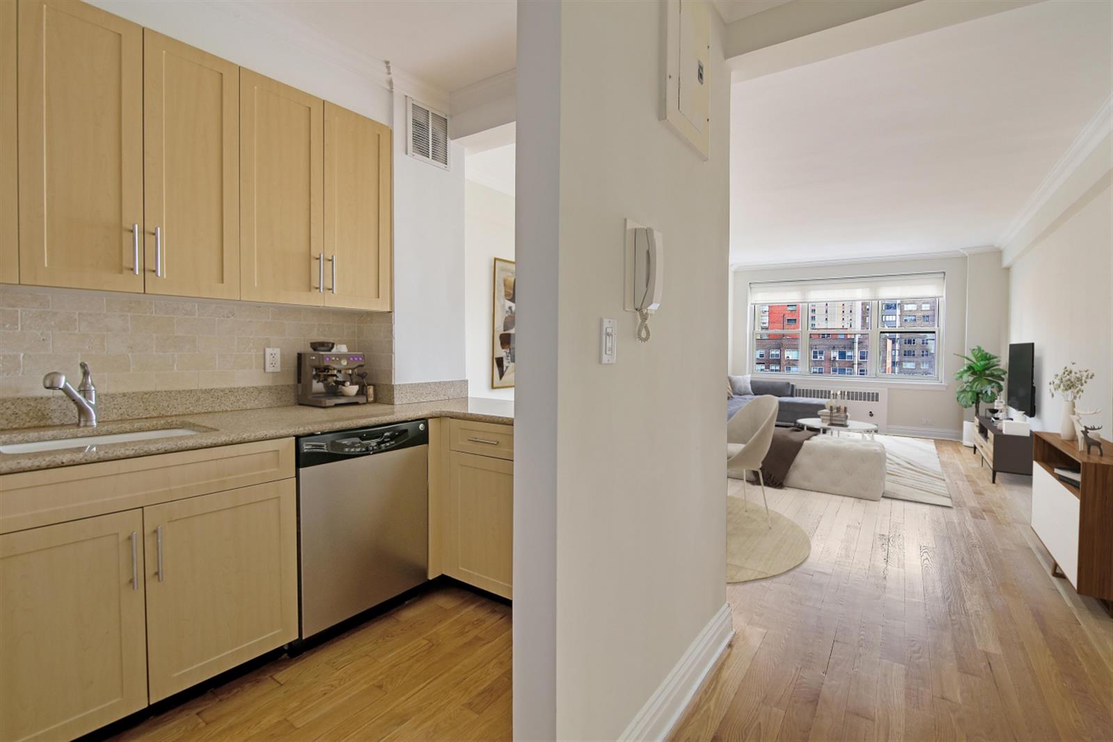 a kitchen with cabinets a sink and appliances