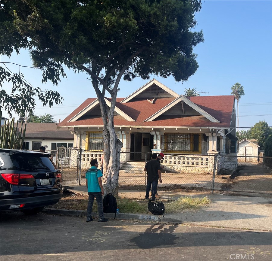 a front view of a house with parking area