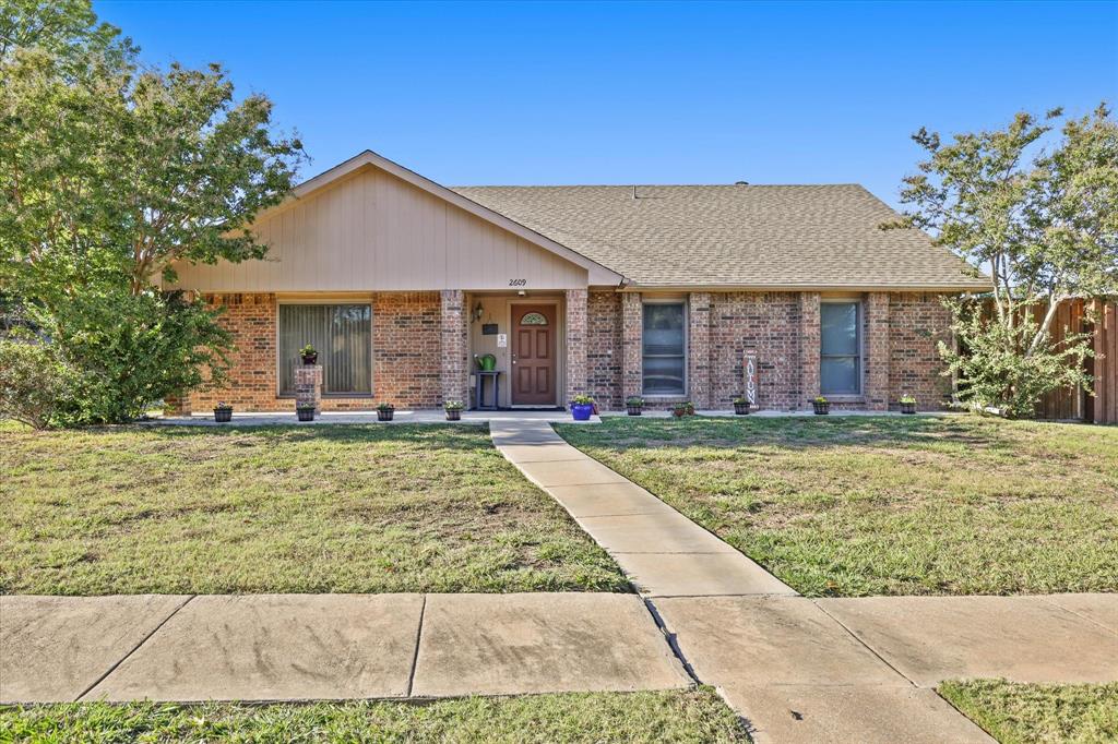 front view of a house with a yard