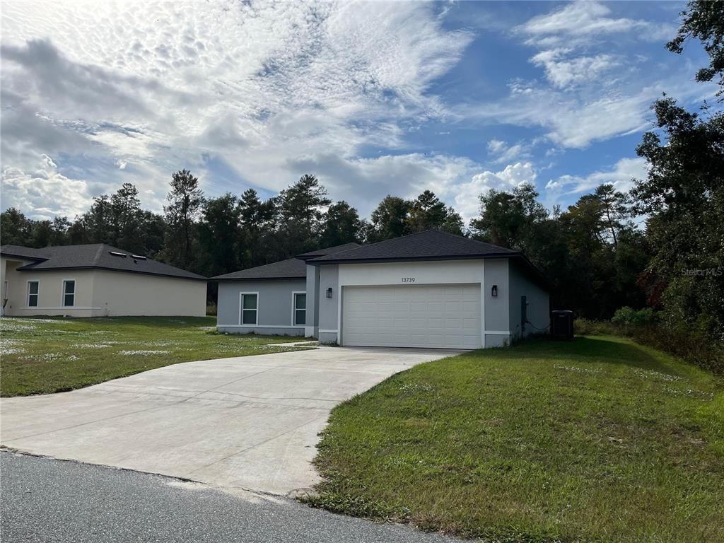 front view of a house with a yard