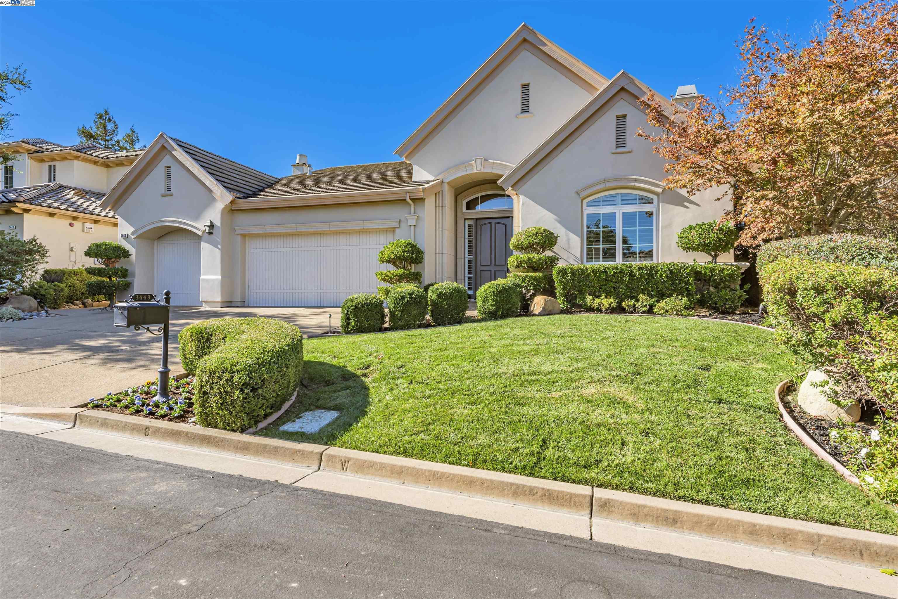 a front view of a house with a yard