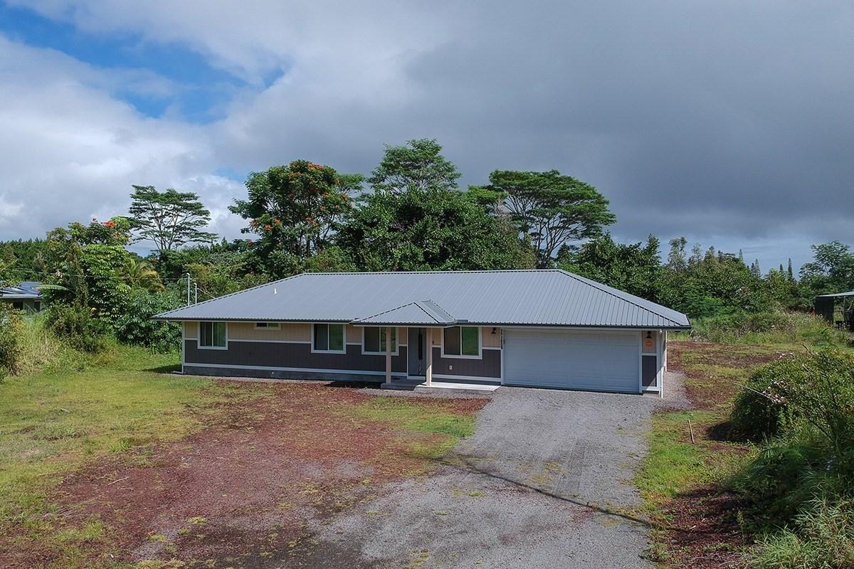 a house with trees in the background