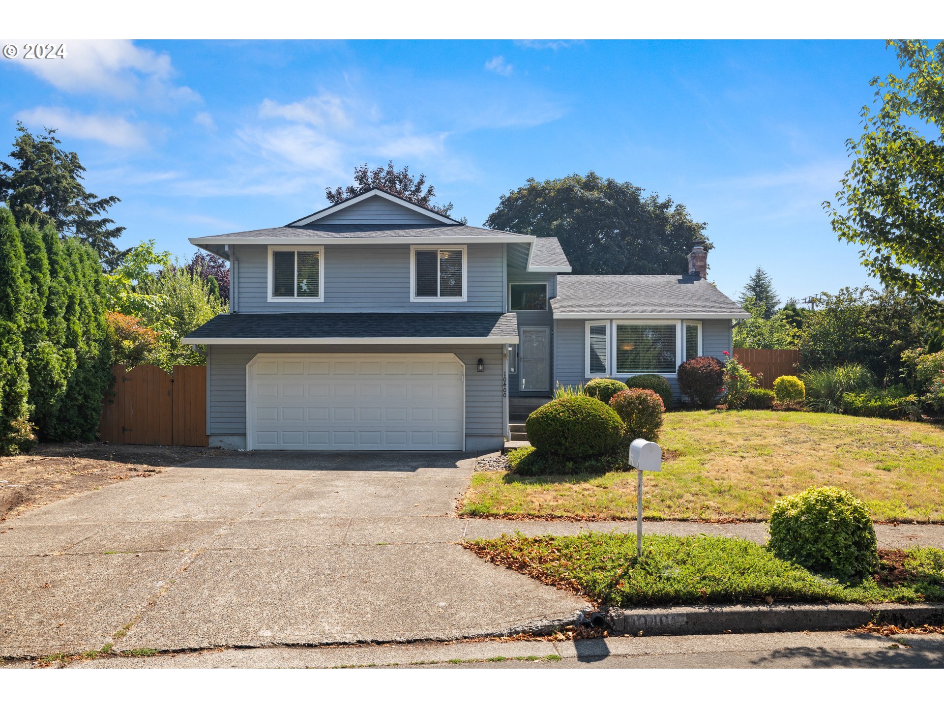 a front view of a house with yard