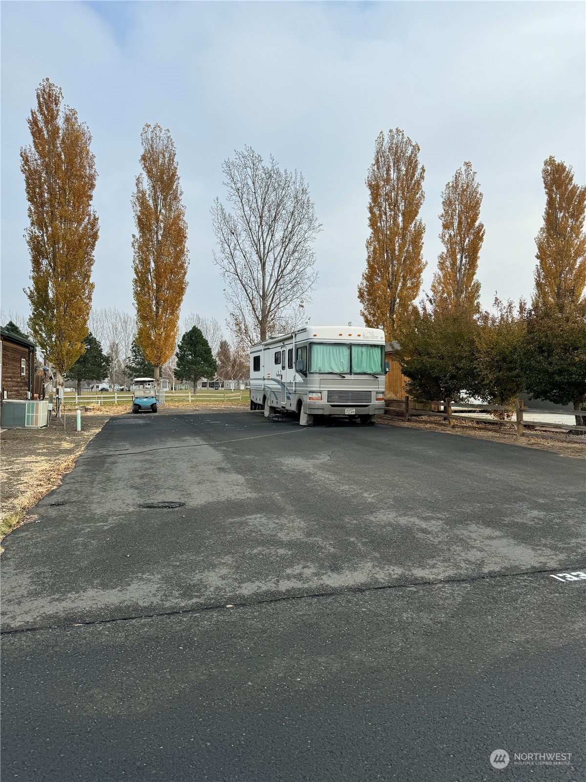 a view of street with parked cars