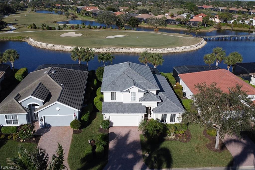 an aerial view of a house with a lake view